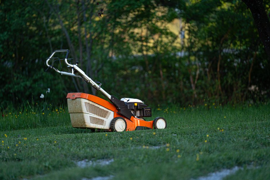Professional lawn mowing service in action on vibrant green yard